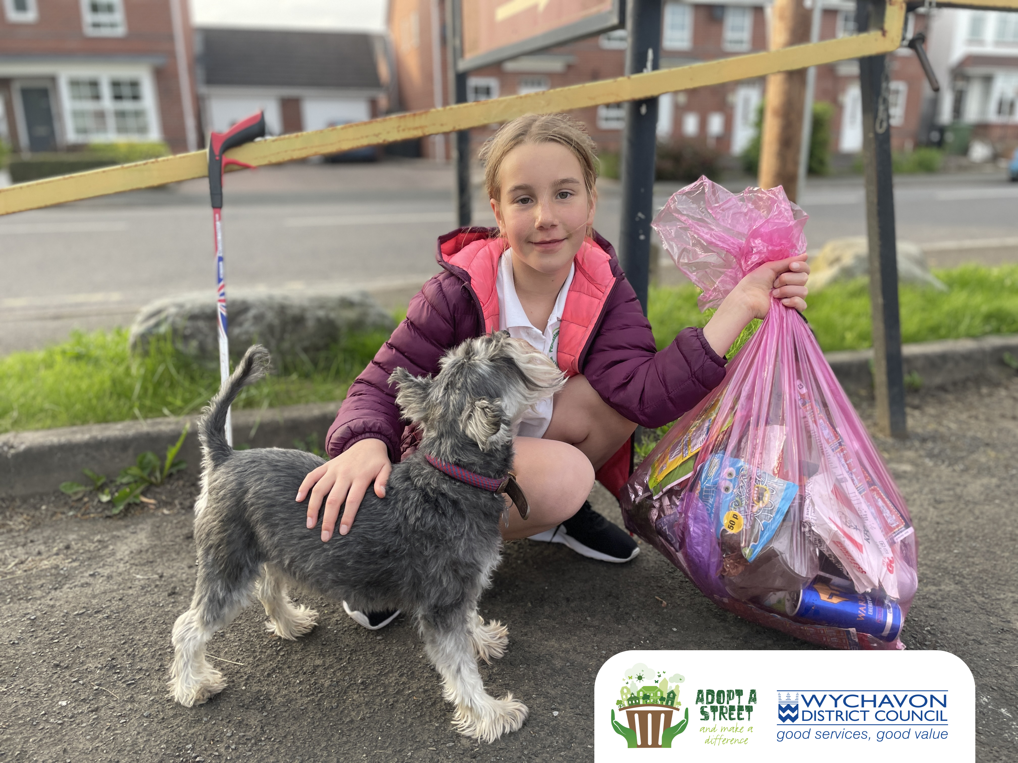 Young girl holding bag of litter