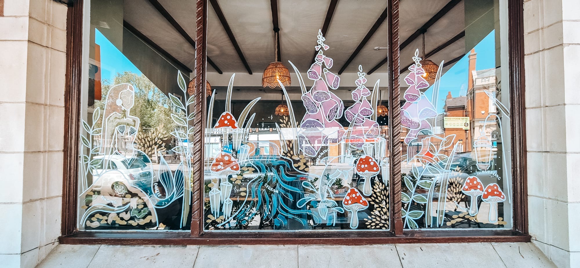 Window display featuring Once Upon a Trail artwork