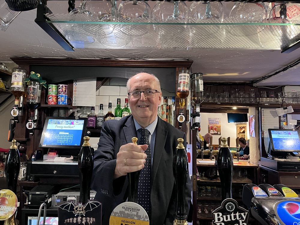 Cllr Richard Morris pulling a pint