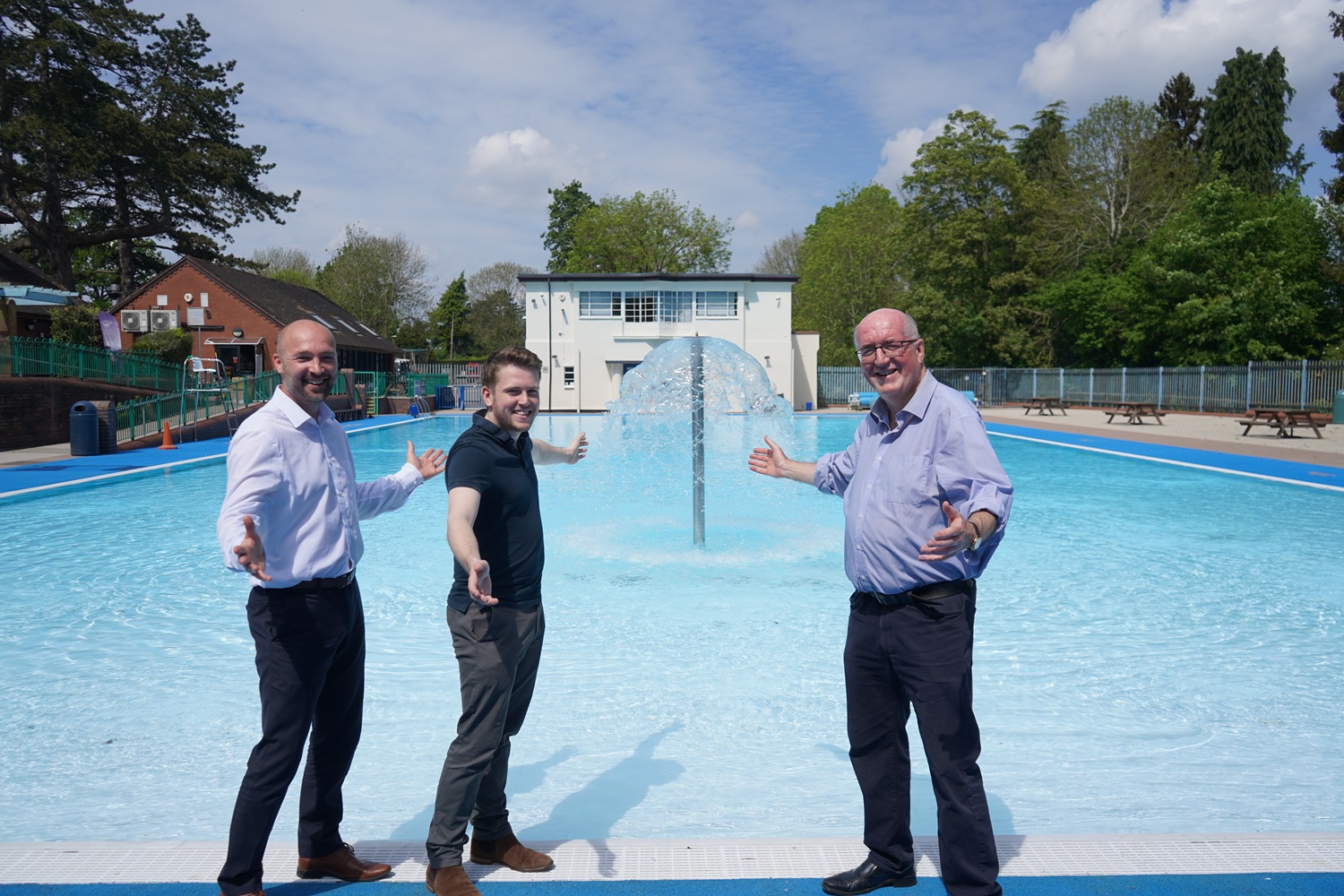Three men stood in front of Droitwich Spa Lido