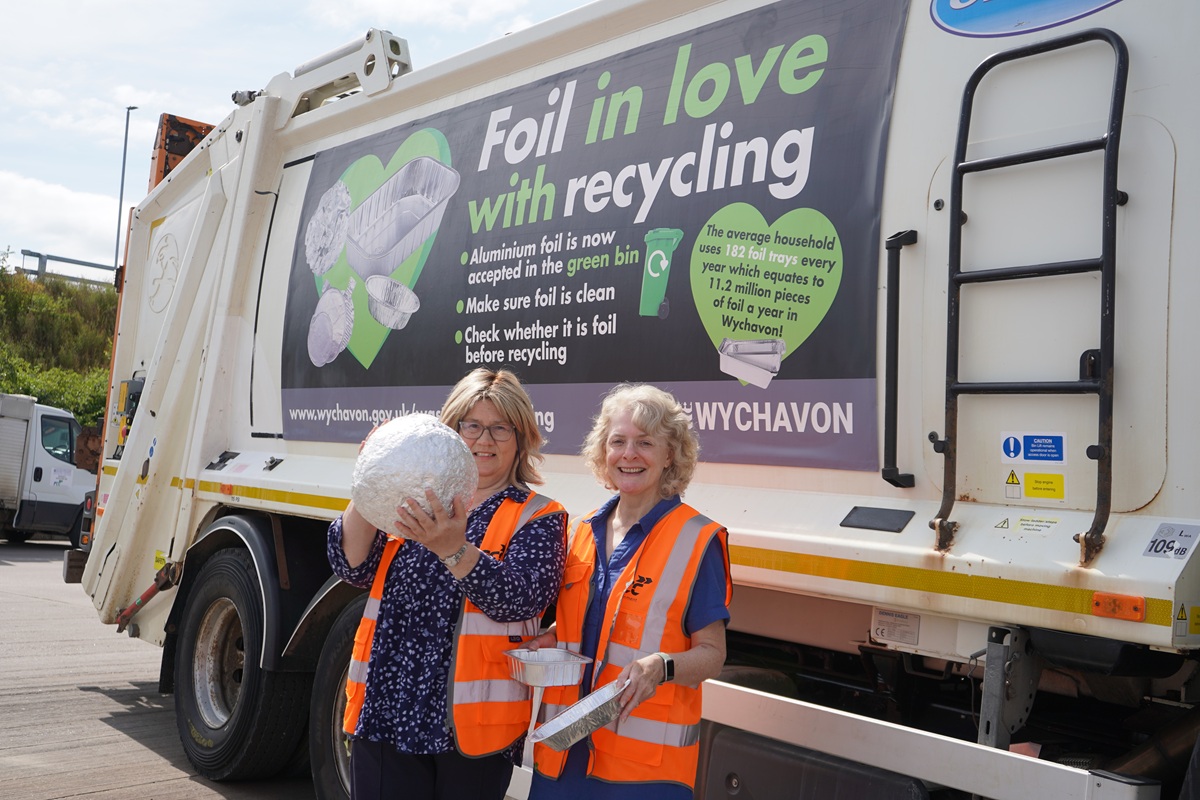 Cllr Emma Stokes, Wychavon's Executive Board Member for Resources, Investment and Innovation holding a giant ball of scrunched foil with Julie Meeks, Administration Manager for Alupro, in front of a bin lorry.