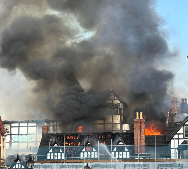 Smoke and flames coming from the Raven Hotel building.