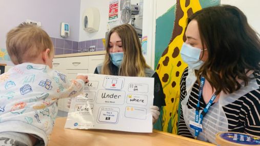 Speech and language therapists working with a child as part of our social mobility work with the NHS